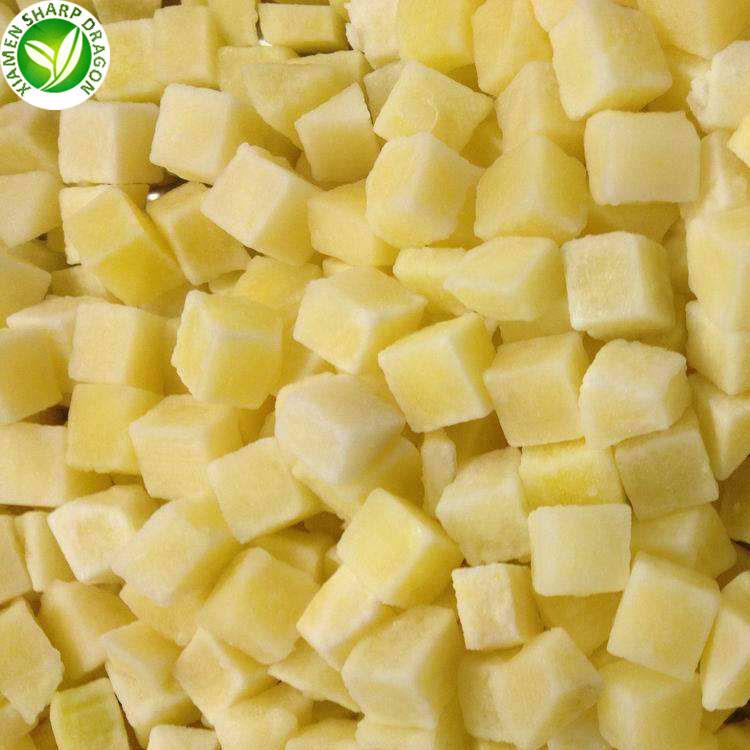 Pale yellow frozen diced potato cubes in a close-up view